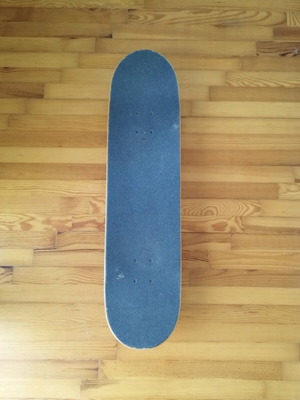 Almost skateboard used complete with Tensor trucks and Darkstar wheels