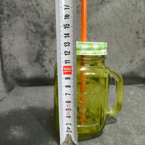 Glass cup with straw used, straw needs replacement