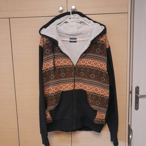 Teen jacket used size large, black with pattern