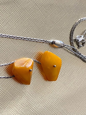 Silver necklace with amber used