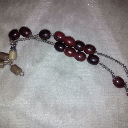 Worry beads used with red-brown plastic beads on metal chain