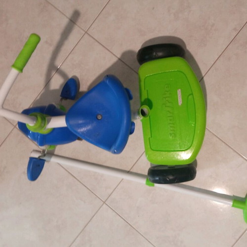 Children's tricycle bike with handle like new, blue and green