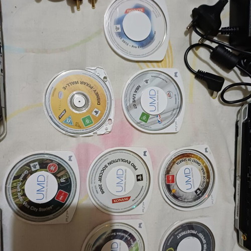 Sony PSP handheld consoles with accessories and games