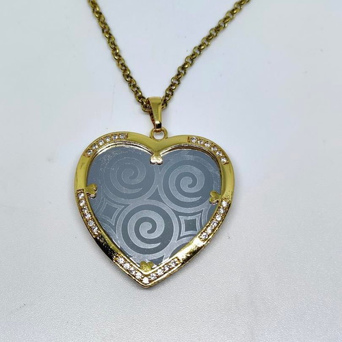 Heart Pendant Necklace with Embossed Spiral Designs, like new