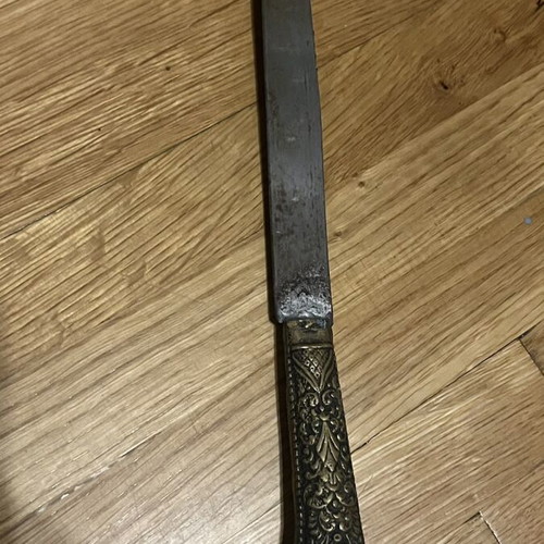 Traditional collectible knife mid-century with carved handle and sheath used