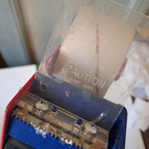 Packing tape gun used with roll included