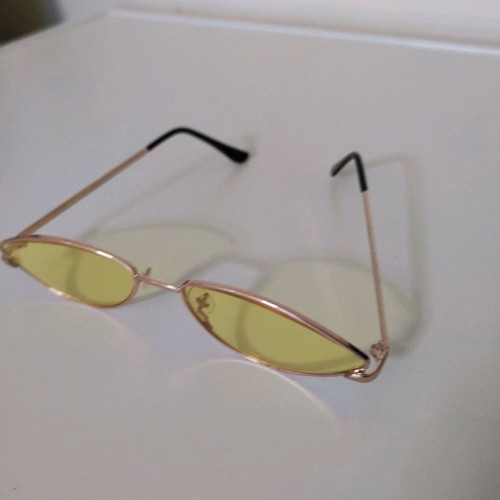 Sunglasses used with yellow lens and lightweight frame