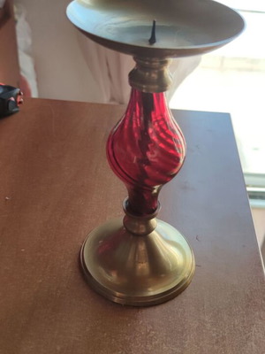 Vintage brass candlestick with red spiral crystal, used