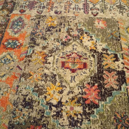 Colorful oriental style rug with distressed look like new
