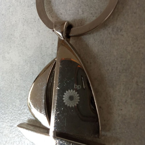Keychain sailboat BP used, silver, 2000s decade