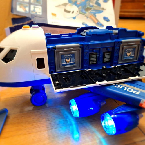 Airplane toy used with lights and sounds, transforms into station