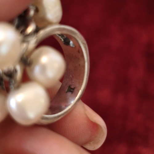 Dyrberg/Kern statement ring used with pearls and iridescent stone