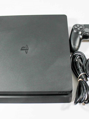 PlayStation 4 Slim 1TB console used with 2 controllers