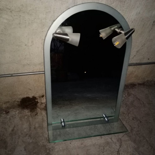 Semi-circular bathroom mirror used with 2 lights and shelf
