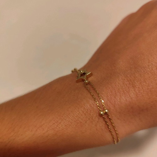 Gold star bracelet 14 karat new, gold color