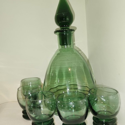 Vintage decanter set with 5 green glass shot glasses used