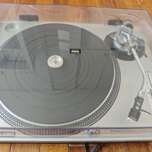 Technics SL-1200MK2 turntable with professional cartridge and dust cover