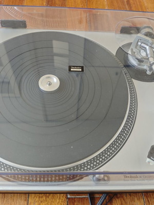 Technics SL-1200MK2 turntable with professional cartridge and dust cover