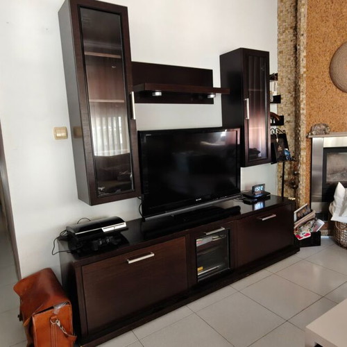 Living room unit used with lower cabinet, wall columns, and shelves