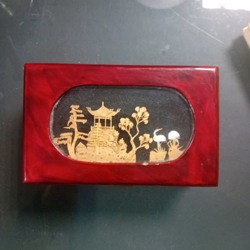 Wooden box used with cork decor under glass