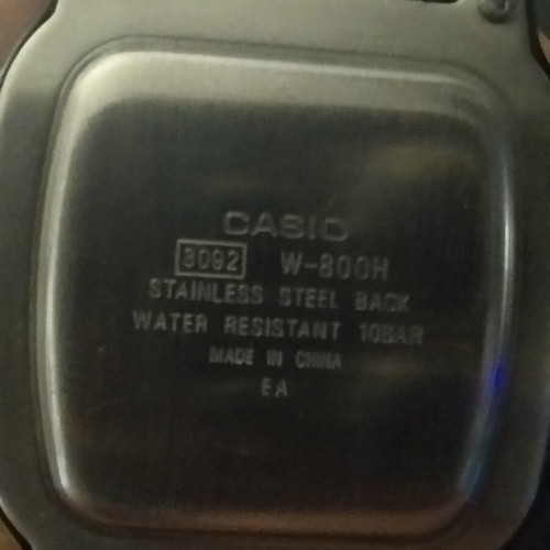 Casio W800H watch with two straps, grey and black