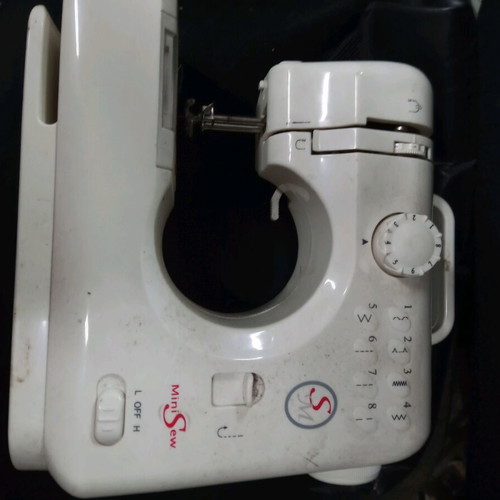 Mini sewing machine used for parts or decor, battery operated