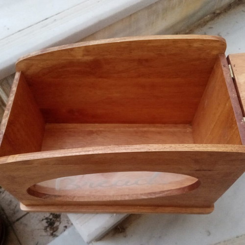 Wooden breadbox with hinged lid and metal handle used