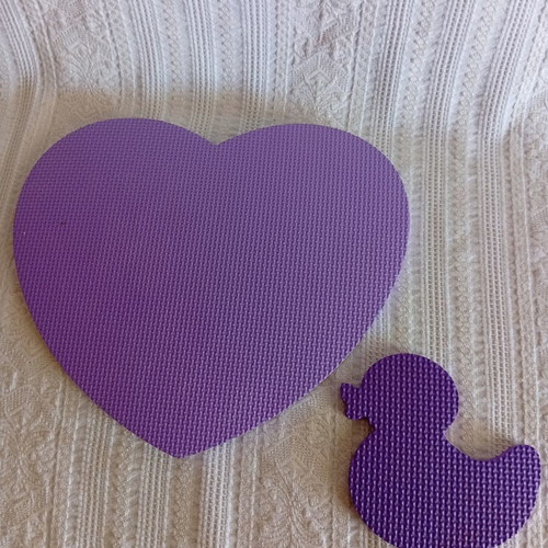 Large heart-shaped foam mat with small duck