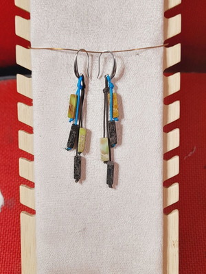 Handmade earrings with silver clasp and green and black stones