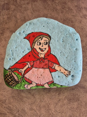 Painted stone with Little Red Riding Hood