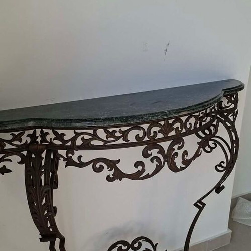 Metal console used with marble top and ornate wrought iron design