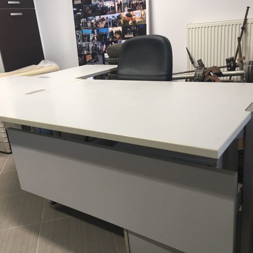 Corner desk used with adjustable height, chair and drawer unit
