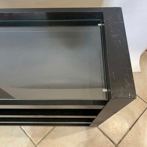 Wooden furniture with glass surface and two shelves on wheels used