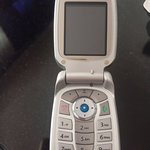 Motorola collectible cell phone like new, silver with flip cover