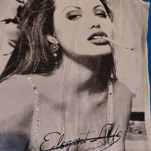 Top with girl print and rhinestones used, gray