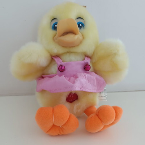 Plush duck with pink dress and sound button