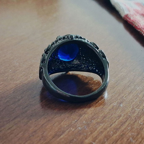 Ring with blue sapphire new, black rhodium plating