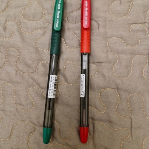 Two new Pilot ballpoint pens, red and green