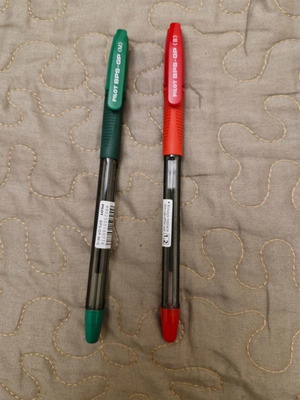 Two new Pilot ballpoint pens, red and green