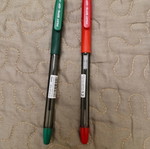 Two new Pilot ballpoint pens, red and green