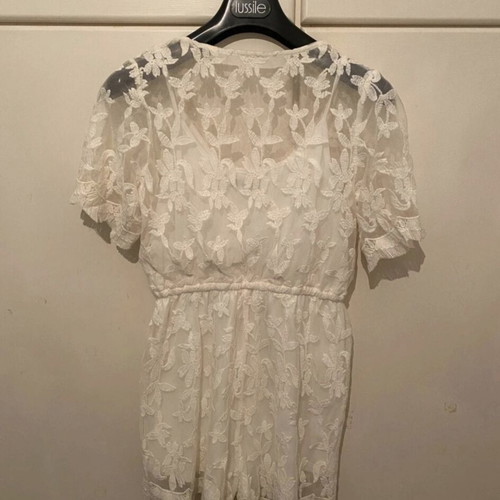 One-piece romper size S like new, white with transparent details