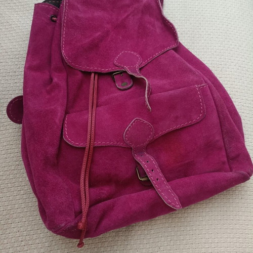 Leather backpack fuchsia used with some wear