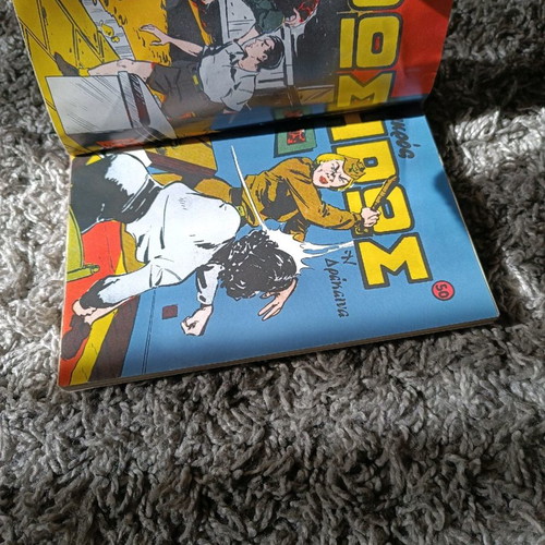 Mikros Iroas comics with worn covers