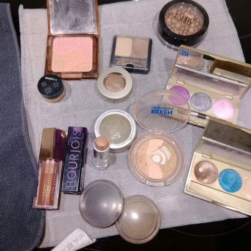 Cosmetics set used with eyeshadows, blushes, lipstick, and lip gloss