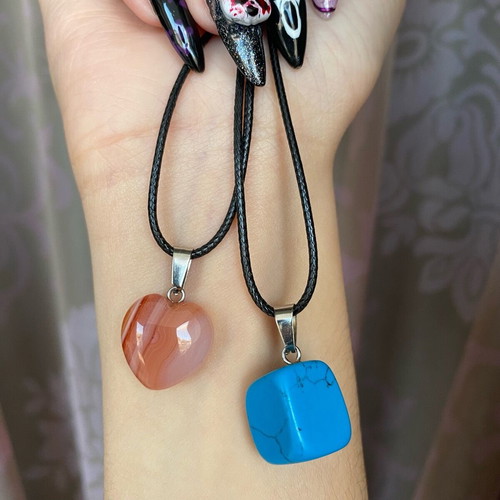 Pack of two crystal necklaces new with black cord unisex