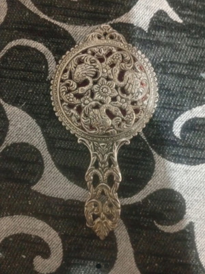 Vintage hand mirror with crack