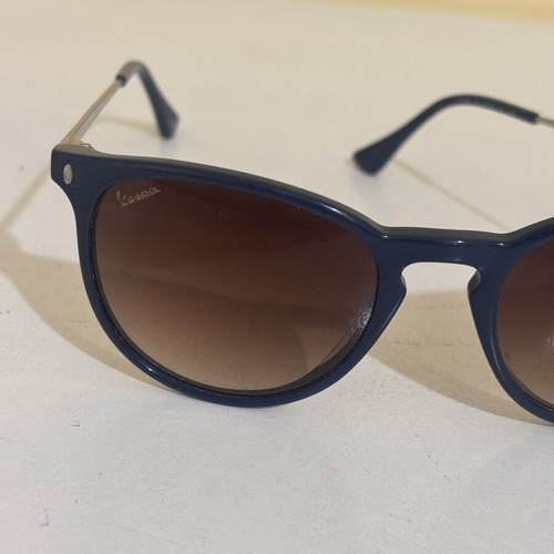 Vespa sunglasses like new, dark blue and silver frame with gradient lenses
