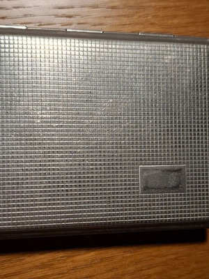 Metal tobacco case used in good condition