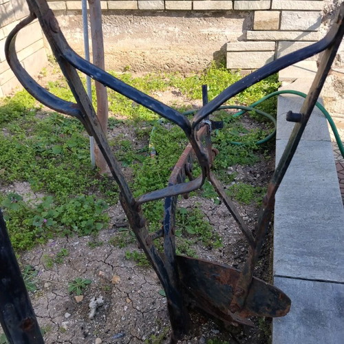 Yni used, old-style soil cultivator for garden decoration