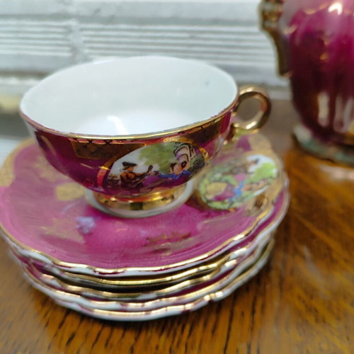Porcelain coffee set used, 15 pieces, burgundy-fuchsia with gold details